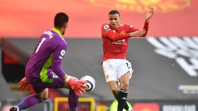 Fulham goalkeeper Alphonse Areola saves from United striker Mason Greenwood. AFP