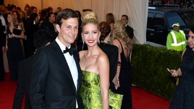 Ivanka Trump, wearing a green brocade Oscar de la Renta gown, attends the 2014 Met Gala with Jared Kushner on May 5, 2014. EPA