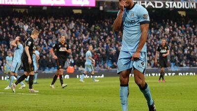 Manchester City's Belgian defender Vincent Kompany, right, reacts during the English Premier League match against Hull City at the The Etihad Stadium in Manchester, England, on February 7, 2015. Oli Scarff / AFP