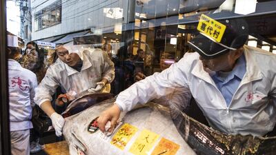 Employees clean the whole tuna at a Sushizanmai restaurant in Tokyo, Japan. Bloomberg