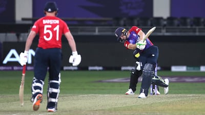 England's Jos Buttler hits a six against Australia in Dubai. AP