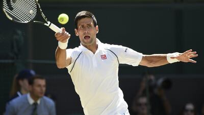 epa04840553 Novak Djokovic of Serbia returns to Richard Gasquet of France in their semi final match during the Wimbledon Championships at the All England Lawn Tennis Club, in London, Britain, 10 July 2015. EPA/FACUNDO ARRIZABALAGA EDITORIAL USE ONLY/NO COMMERCIAL SALES