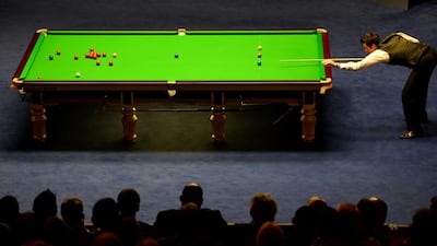 Ronnie O’Sullivan of England plays a shot against Barry Hawkins of England during the final match of the 2013 World Snooker Championships at The Crucible. AFP PHOTO/PAUL ELLIS