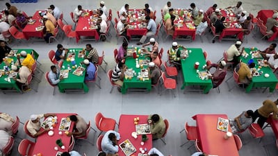 Men fill up the dining hall as they all join in to break their fast at Iftar at the Saadiyat Accommodation Village on the Saadiyat Island in Abu Dhabi. July 23, 2013. Silvia Razgova / The National