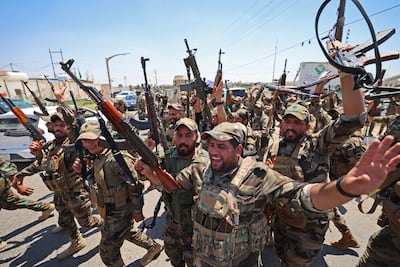 Members of Saraya al Salam at a ceremony in Samarra in June marking their integration into the Iraqi security forces. AFP