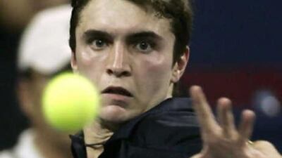 Gilles Simon thwarted the defending Masters Cup champion Roger Federer in three sets, in the first round of matches in Shanghai.