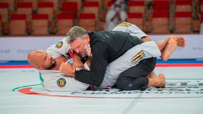 Brazilian Igor Silva (in white) won the Abu Dhabi World Masters-1 black belt 120kg heavyweight final from Canadian Bruno Munduruca at the Jiu-Jitsu Arena at the 12th staging of the World Pro on April 7, 2021. Courtesy UAEJJF