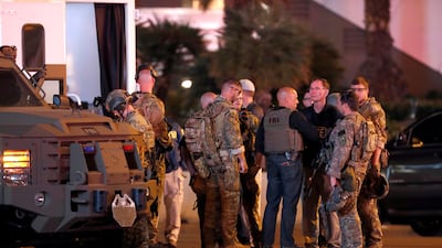 FBI agents confer in front of the Tropicana hotel and casino on October 2, 2017 after a mass shooting during a music festival on the Las Vegas Strip in Las Vegas, Nevada. Las Vegas Sun / Steve Marcus / Reuters