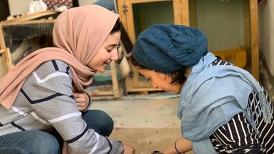 Razan Alnajar and Iman care for some kittens. Nagham Mohanna for The National