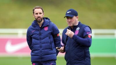 England manager Gareth Southgate and assistant Steve Holland, right. PA
