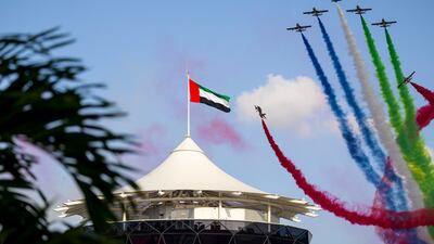 The UAE's Al Fursan aerobatic team performs near Shams Tower at the Formula 1 Etihad Airways Abu Dhabi Grand Prix. Ryan Carter / Presidential Court