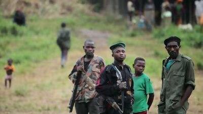 Rwandan Hutu rebels stand watch outside a UN encampment in Kimua, eastern Congo.
