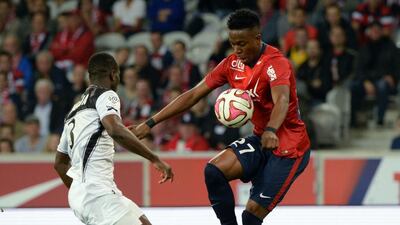 Lille's Divock Origi, right, controls the ball in a Ligue 1 match against Guingamp last Saturday. Denis Charlet / AFP / October 18, 2014