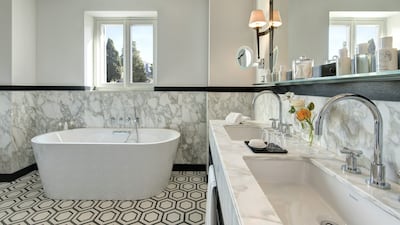 A marble-clad bathroom at Hotel De La Ville.