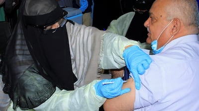 Civil service minister Abdul-Nasser Al Wali, receives the AstraZeneca vaccine at a medical centre in Aden. Reuters