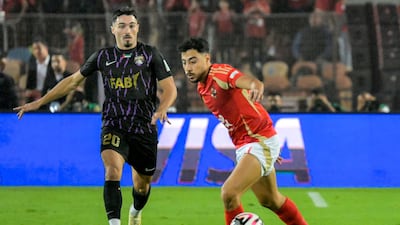Al Ain's Matias Palacios closes down Al Ahly's Akram Tawfik. AFP