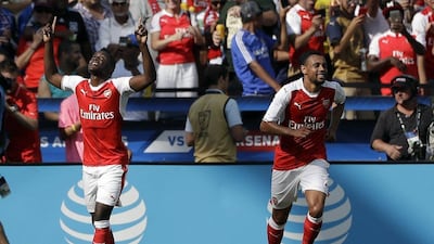 Arsenal forward Joel Campbell, left, celebrates his goal with teammate Francis Coquelin during the first half of the MLS All-Star game against the MLS All-Stars on Thursday, July 28, 2016, in San Jose, California. Marcio Jose Sanchez / AP Photo