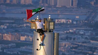 Sheikh Hamdan bin Mohammed bin Rashid, the Crown Prince of Dubai, atop of the Burj Khalifa on November 25 to mark National Day and as part of Dubai’s winning Expo 2020 campaign. Ali Hissa - personal photographer for Sheikh Hamdan / AFP Photo