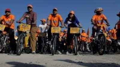 People participate in the Cycle-a-thon to raise awareness of obesity yesterday in Dubai.