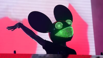 Electronic music DJ and producer Deadmau5, aka Joel Zimmerman, performs in his $6,000 custom-made mouse helmet. AP Photo