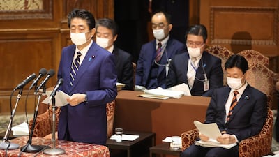 Japan's Prime Minister Shinzo Abe delivers a report to committee members of the Lower House in Tokyo on April 7, 2020 before declaring a state of emergency. AFP