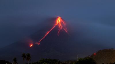 Lava continues to cascade down the slopes of Mayon volcano as seen from Legazpi city, Albay province, around 340 kilometres southeast of Manila, Philippines. Earl Recamunda / AP Photo