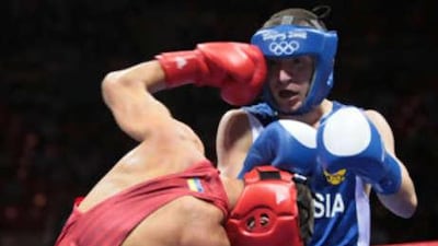 Russia's Albert Selimov (R) fights against Ukraine's Vasyl Lomachenko during their 2008 Olympic Games Featherweight (57 kg) boxing bout on August 11, 2008 in Beijing.