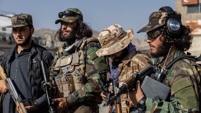Taliban guards patrol the streets of Kabul. Stefanie Glinski / The National