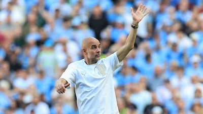 Pep Guardiola waves goodbye to Manchester City fans at the Etihad Stadium in East Manchester. The Spanish manager has brought unprecedented success to the club since his appointment in 2016. AFP
