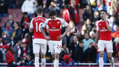 Arsenal’s Hector Bellerin, Aaron Ramsey and Gabriel Paulista look dejected after the game. Reuters / Stefan Wermuth