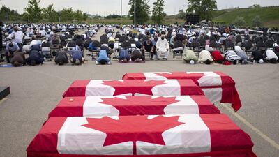 Mourners and supporters gather for a public funeral for members of the Afzaal family in London, Ontario. Getty Images/AFP