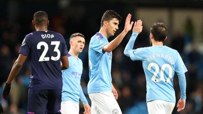 Bernardo Silva and Rodrigo of Manchester City celebrate after the win. Getty