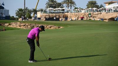 Patrick Reed plays his third shot on the 18th hole. Getty