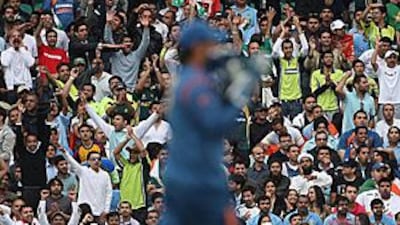 Pakistan and India fans watch their countries face each other during a warm-up for the World Twenty20 at the Oval in London.