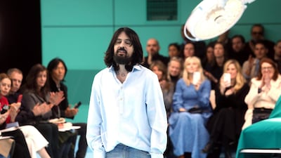 Alessandro Michele appears on the catwalk after his show for Gucci during the Milan Fashion Week on February 21. EPA