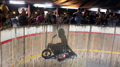 Motorcycle driver Zoran Milojkovic performs his stunt at the 'Bozo Vukadinovic' wall of death in Belgrade, Serbia. EPA