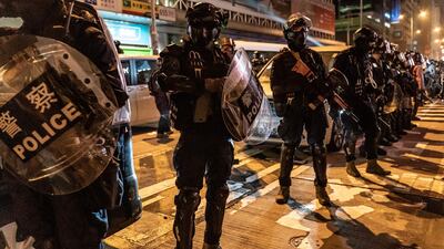Riot police secure an area in Mongkok district in Hong Kong, China. Anti-government demonstrations have stretched into their fifth month. Getty