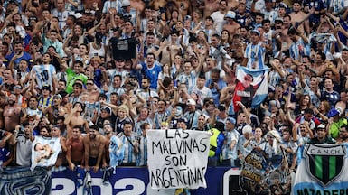Argentina fans at the World Cup display a banner with a message referring to their country's claim to the Falkland Islands. Reuters