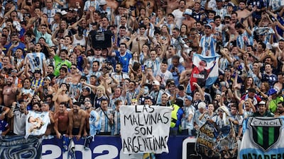 Argentina fans at the World Cup display a banner with a message referring to their country's claim to the Falkland Islands. Reuters