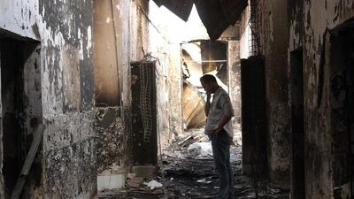 An employee of Doctors Without Borders walks inside the charred remains of their hospital after it was hit by a U.S. airstrike in Kunduz, Afghanistan. Najim Rahim / AP Photo