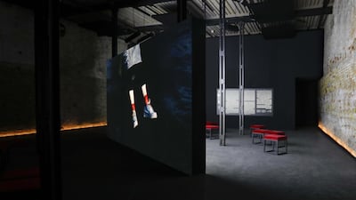 The video is in two channels that are projected onto either side of a screen that bisects the room.