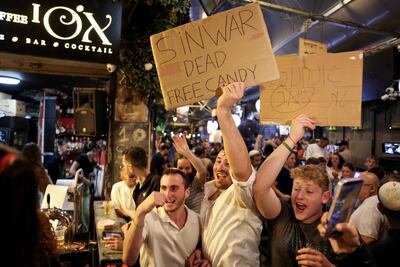 People in celebrate in Jerusalem on Thursday night after the Israeli military confirmed the death Hamas leader Yahya Sinwar. AFP