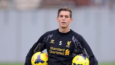 Despite having a skill set seemingly ideal for his manager's style of play, Daniel Agger, pictured at training on October 31, 2013, has struggled to find playing time for Liverpool this season. John Powell / Getty Images