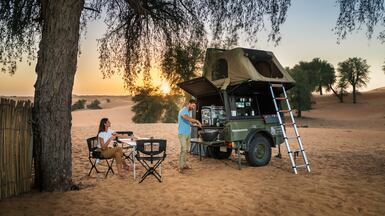 Sand Sherpa's camping trailers are equipped with a rooftop tent, outdoor sofa, firepit and bedding. Photo: Sand Sherpa