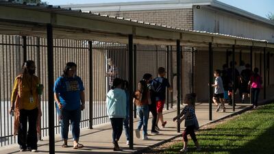 Students at Louise Elementary School walk along a passageway, during the coronavirus pandemic in Louise, Texas. Reuters