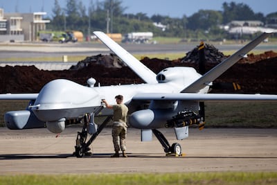 A technician works on a US Air Force MQ-9 Reaper drone at Rafael Hernandez Airport in Aguadilla, Puerto Rico. Reuters