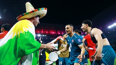 Iraq's Ali Al Hamadi, who opened the scoring in the first hald, celebrates with teammates. Reuters