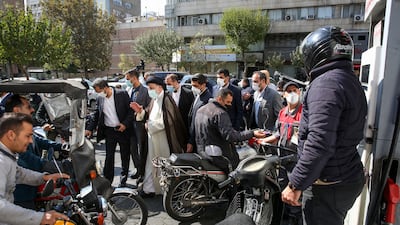 Iranian President Ebrahim Raisi visits a petrol station in Tehran. AFP