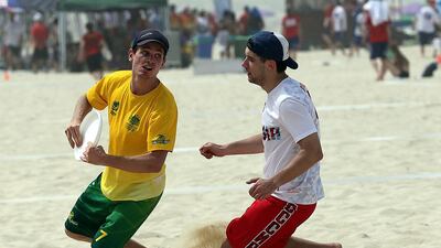 Australia (Green) and Russia (White) in action during the 2015 World Championships of Beach Ultimate (WCBU) at the JBR beach in Dubai. Satish Kumar / The National