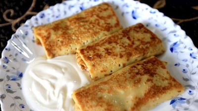 Pancakes with Cabbage stuffed rolls, prepared by Anna Hlushko. Ravindranath K / The National